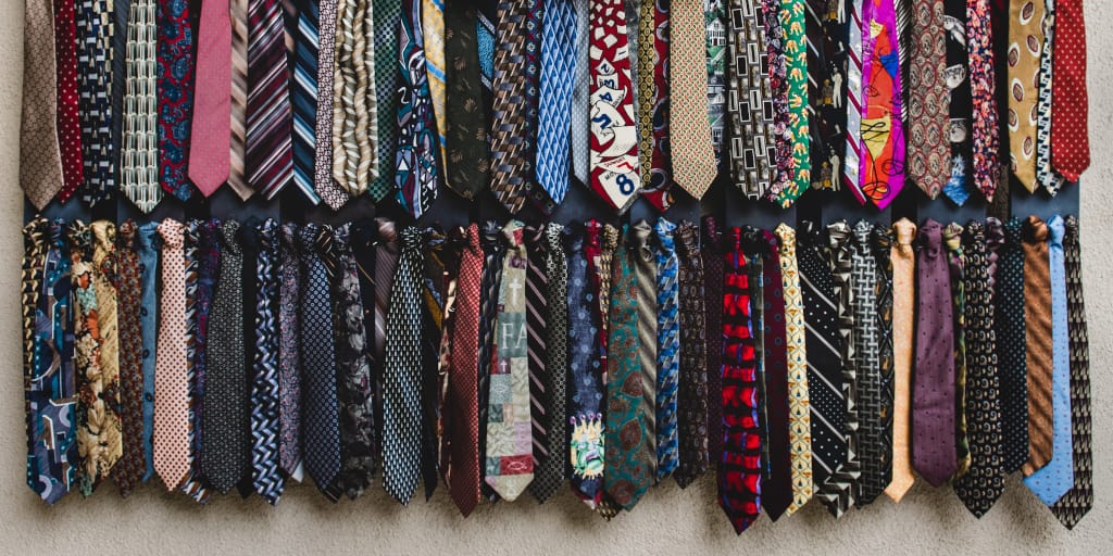 Anything-You-Want. Photo by Tim Mossholder on Unsplash. Image of ties hanging in rows.