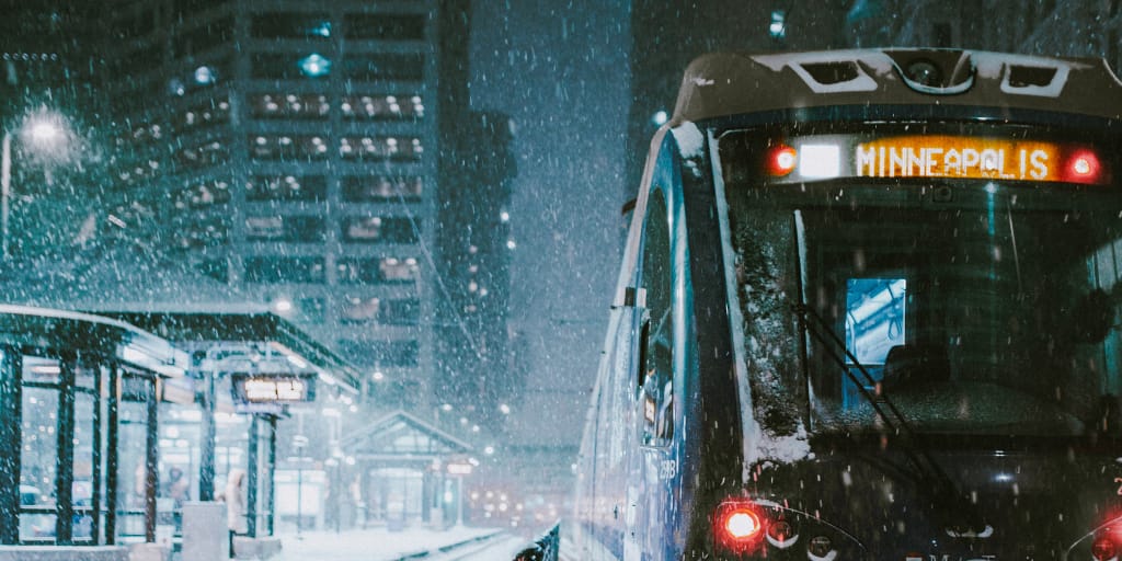 Boiling Over. Photo by Josh Hild on Unsplash. Image of bus driving in snow at night.