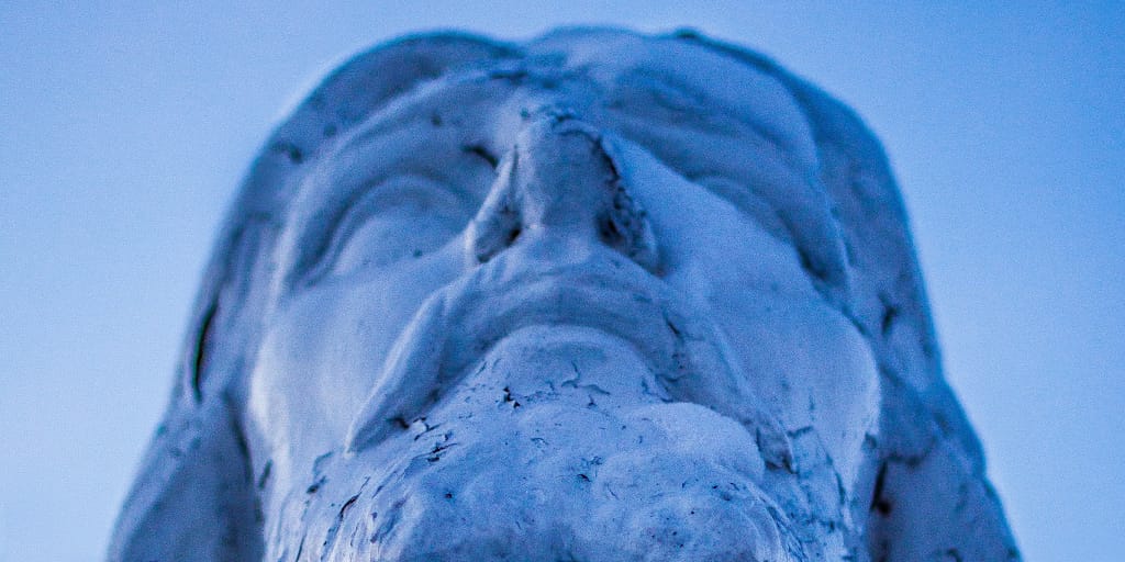 The Miracle of Bradford Town. Photo by Scott Rodgerson on Unsplash. Close up image of Christ statue's face.