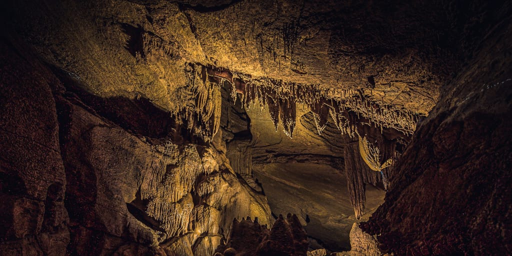 Dig Dig Dig. Photo by Jed Owen on Unsplash. Shows caverns and tunnels.