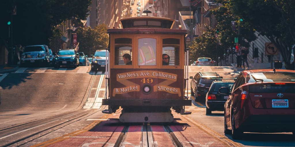 The Problem With Trolleys. Photo by Amogh Manjunath on Unsplash. Shows Californian tram in sunshine.