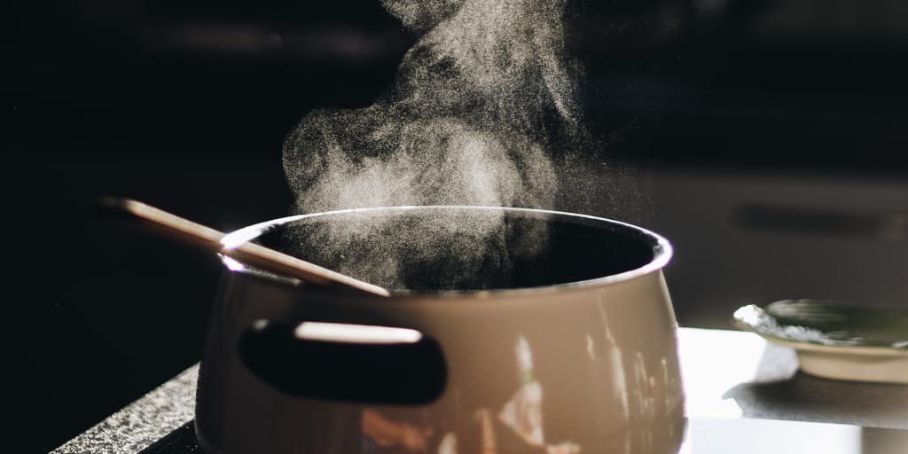 Mood of the Meal_Photo by Gaelle Marcel on Unsplash. Shows saucepan on stove with steam rising from it.